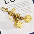 New cross-border fashion wholesale two-color dice keychain women's bag pendant jewelry exquisite car keychain accessories
