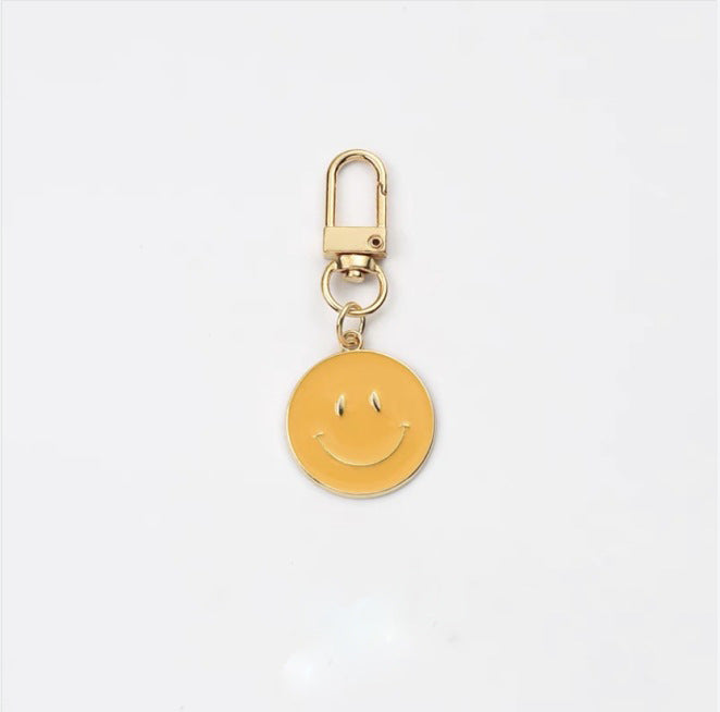 Cross-border e-commerce alloy color dripping smiley face keychain electroplated gold irregular expression bag pendant accessories